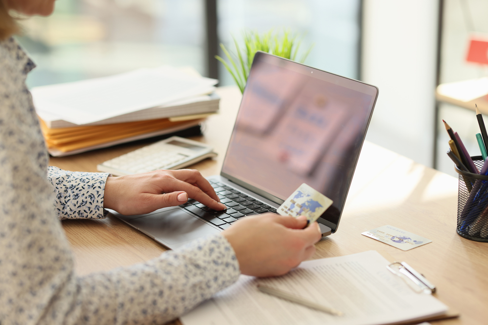 Female Employee Makes Online Payment for Services on Website